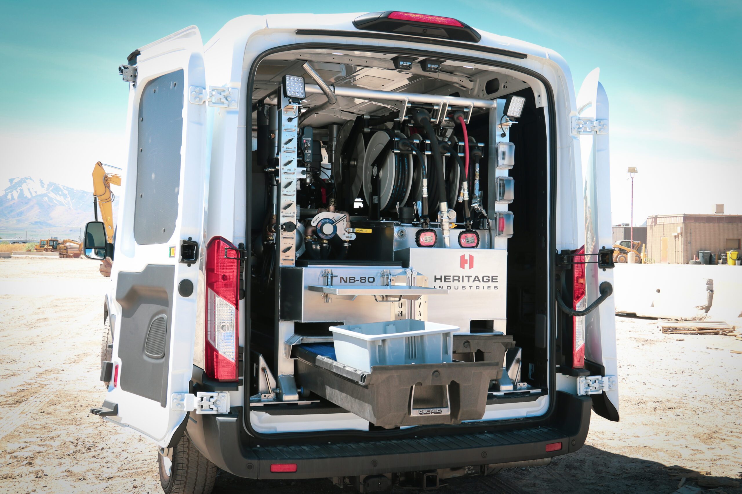 Heritage NB-80 lube skid installed in a service van, reels and drawers visible